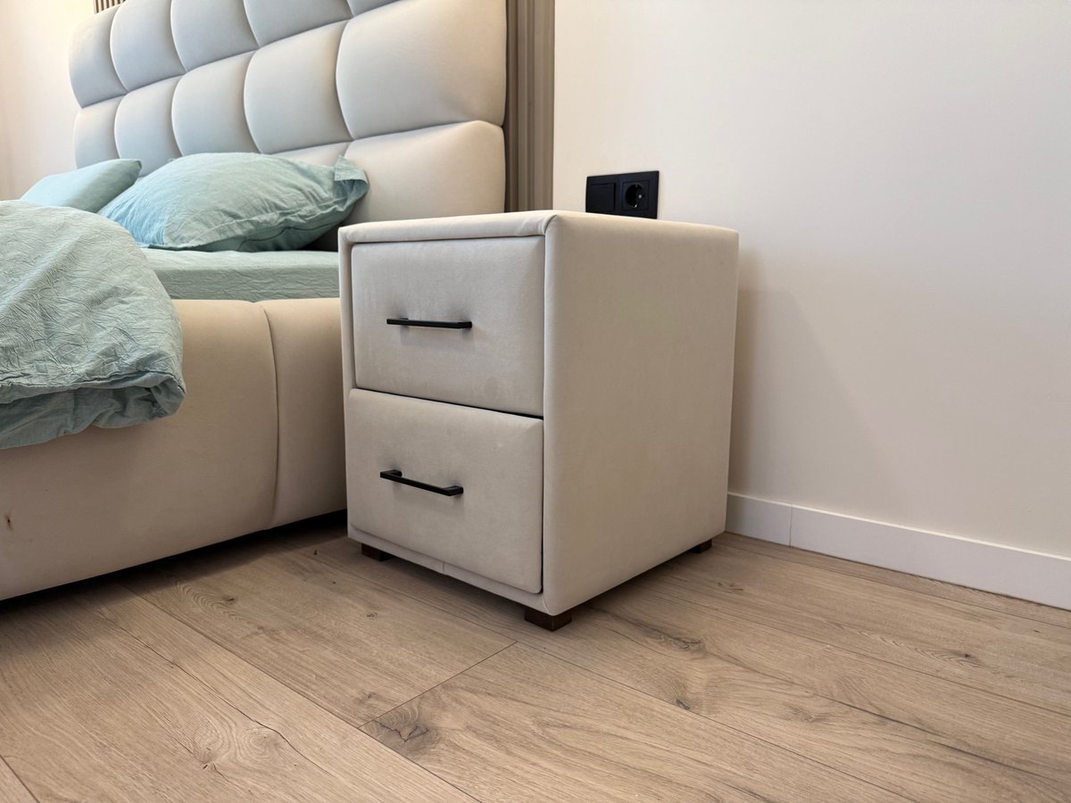 Queen bed made up with the Monbix comforter set beside a wooden nightstand